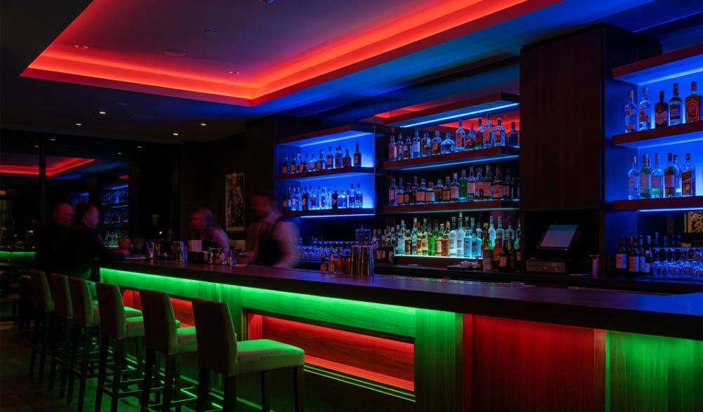 AI generated image of a bar with red, green and blue LED lighting