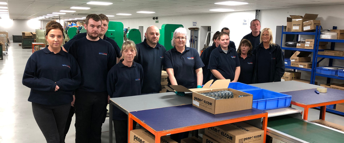 Staff posing at the new Lock Line in our factory in Washington, UK