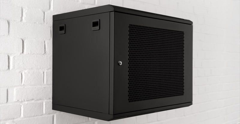 Penn Elcom black wall mount cabinet mounted on white brick wall