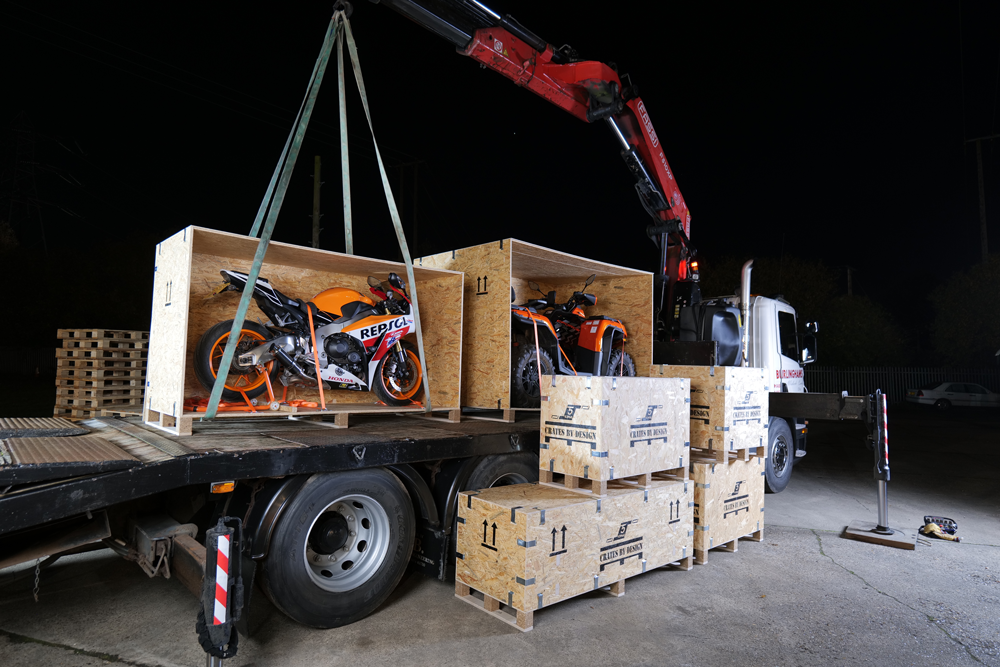 Crate preparing to move super motorcycles in crates.