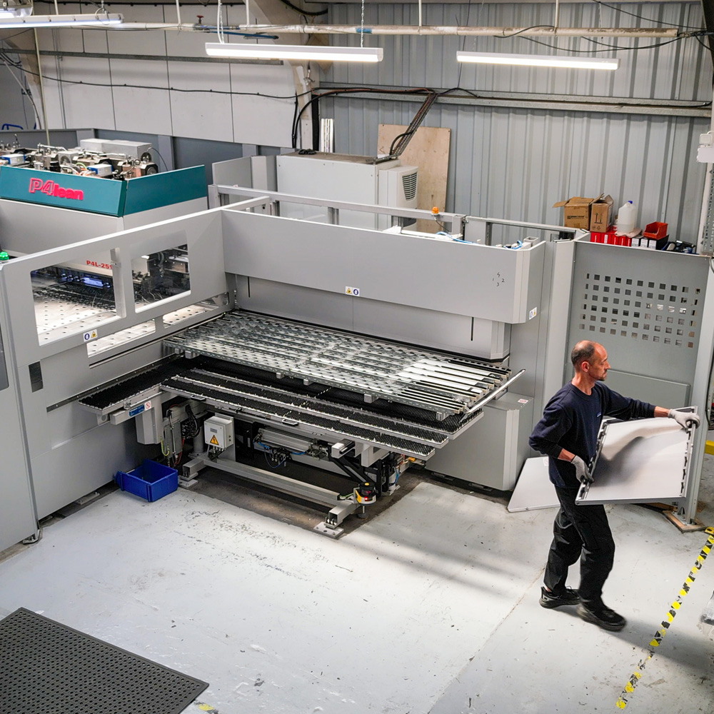 man removing formed product from Salvagnini machine