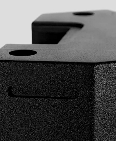 close up of black textured armacab paint on speaker cabinet