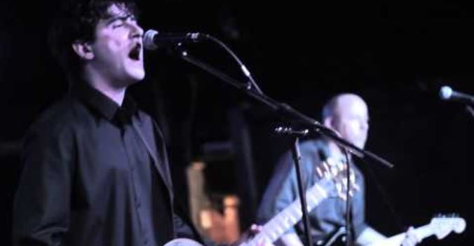 Front man Chad Pearman with guitar