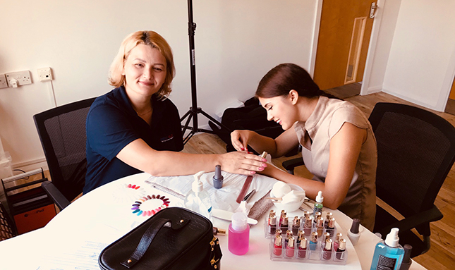 Penn Elcom colleague getting her nails done by a beautician