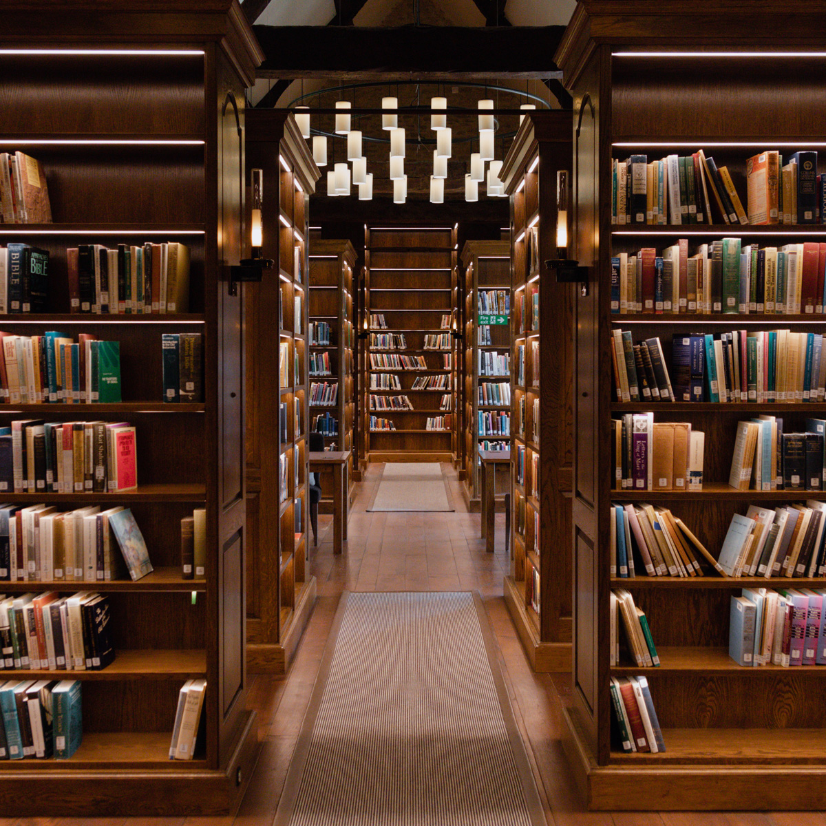 Lanier Theological Library with books either side and lighting