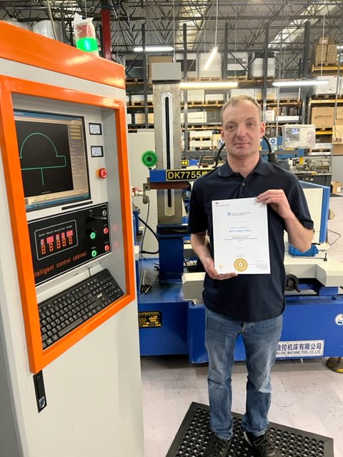 Mark holding his certificate