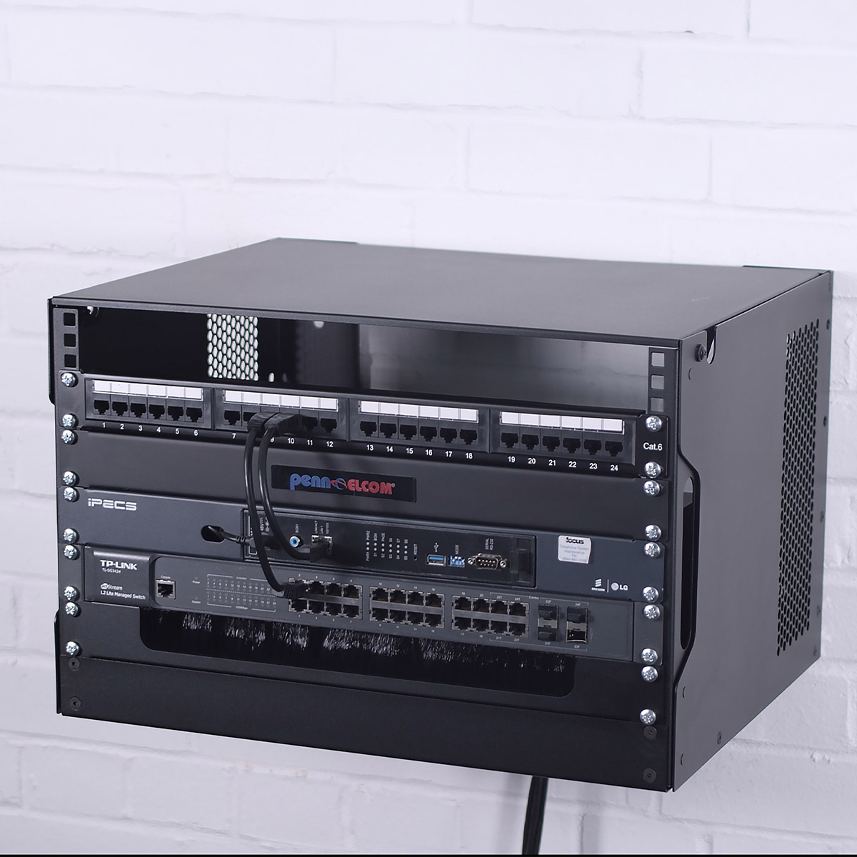 drop down wall rack mounted on white brick wall with mounted equipment