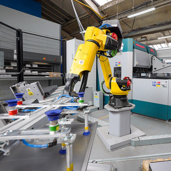 yellow robotic arm robot in action at Penn Elcom 