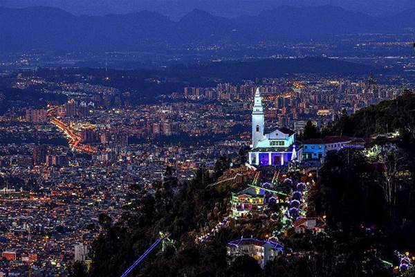 Bogota skyline with bright church on the hill