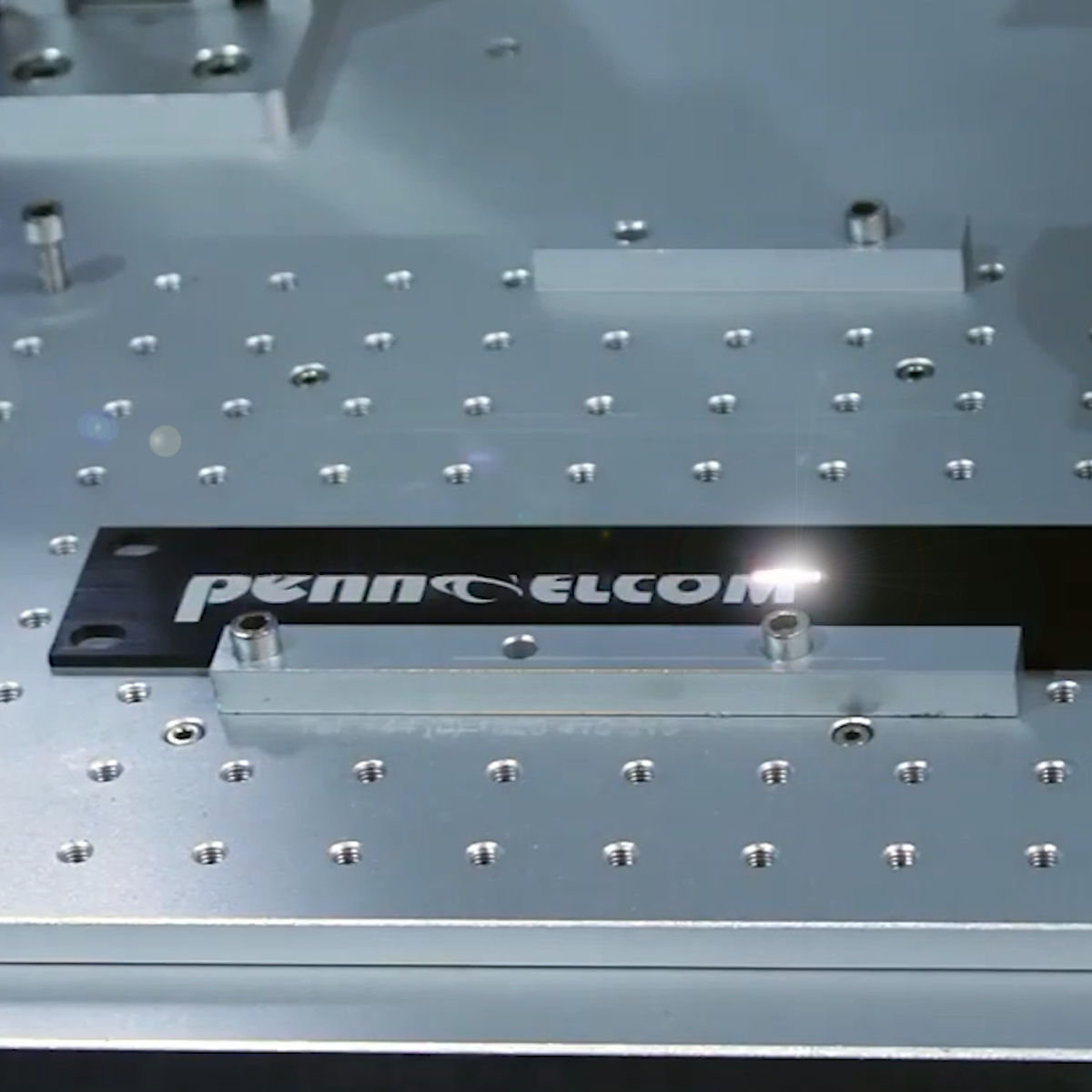 Penn Elcom logo being laser etched on panel 